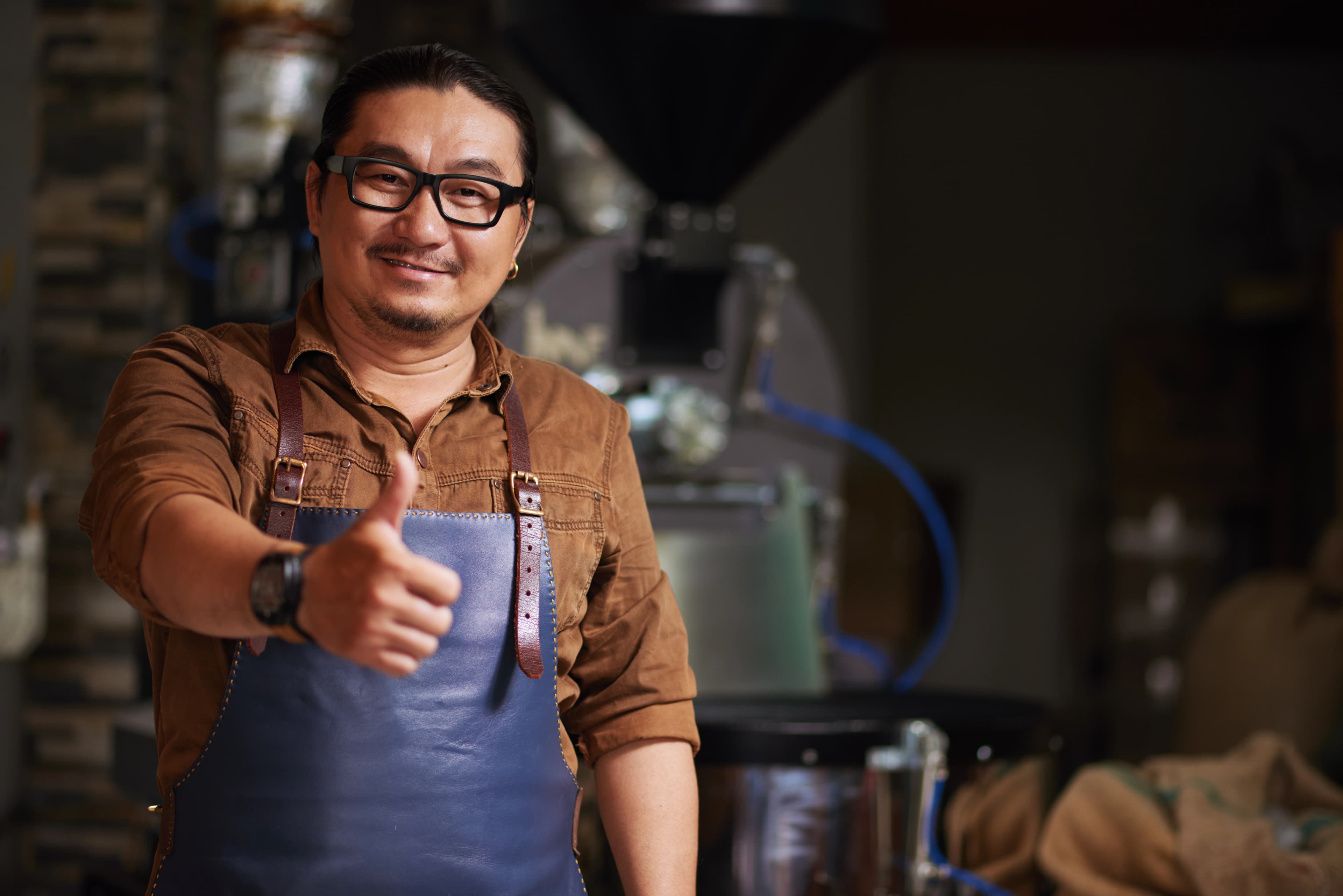 Middle aged asian man posing